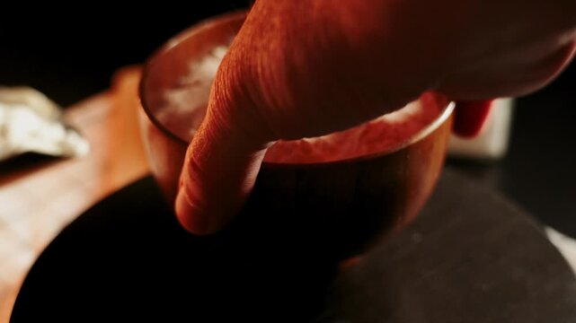 Mixing flour for baking in a kitchen setting during daytime hours