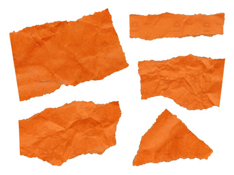 Assorted torn and crumpled vibrant orange paper fragments featuring a subtle wave and sun pattern.