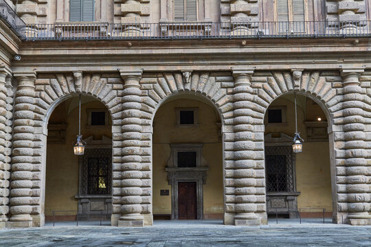 Rusticated palace entrance with arches in Renaissance Florence