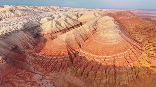 Colorful layered sedimentary mountains with geological erosion pattern of Altyn Emel national park in Kazakhstan