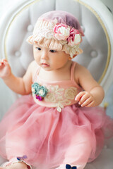 Fototapeta premium Cute Asian baby girl wearing a woolen hat