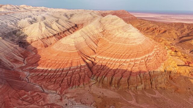 Colorful layered sedimentary mountains with geological erosion pattern of Altyn Emel national park in Kazakhstan