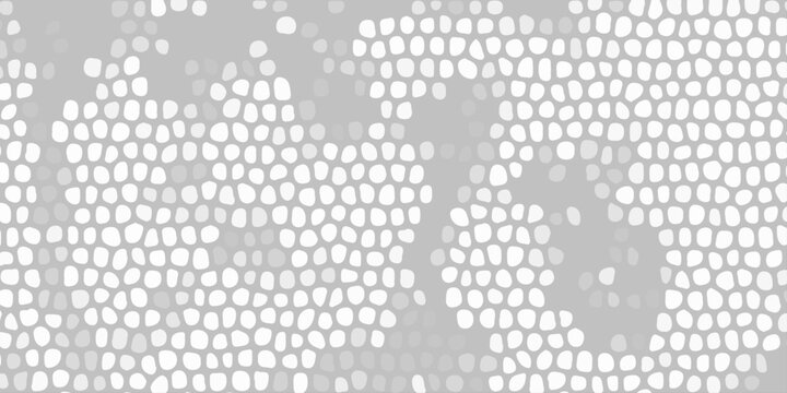 Abstract gray mosaic pattern with white cellular shapes, organic texture background for modern graphic design layout. A densely patterned abstract background featuring numerous irregular white shapes 