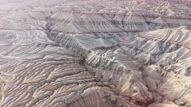 Layered sediment mountains with geological texture of Altyn Emel national park in Kazakhstan