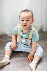 Naklejka premium Cute Asian boy indoors