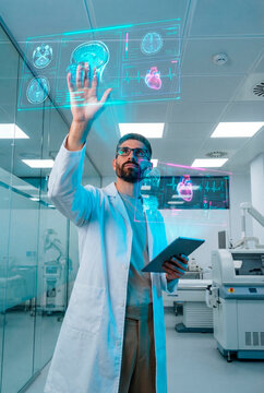 Doctor interacting with holographic brain and heart data in laboratory