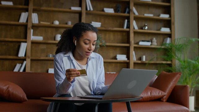 Happy customer shopping online with credit card