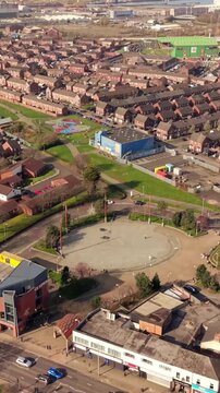 60FPS vertical social ratio passover aerial GV of C.S. Lewis Square in East Belfast, Northern Ireland in the UK. Produced in 1080x1920 with Rec709 color.