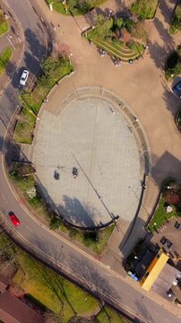 Overhead 60FPS vertical social ratio aerial GV of C.S. Lewis Square in East Belfast, Northern Ireland in the UK. Produced in 1080x1920 with Rec709 color.