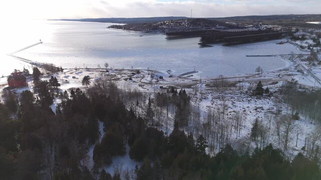 Bay at Two Harbors Minnesota during a winter sunset with Lake Superior frozen