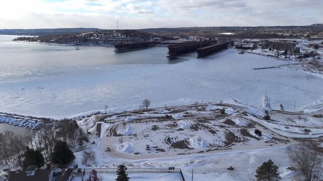 Bay at Two Harbors Minnesota during a winter sunset with Lake Superior frozen 2
