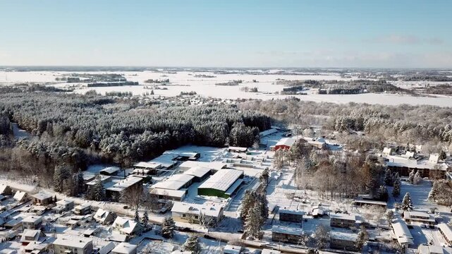 Aerial view of the winter landscape over the Rakvere industrial zone and bus depot facility.