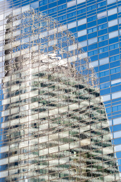 Skyscraper glass facade with modern architecture reflection emphasizing steel structure and construction mood around office building development