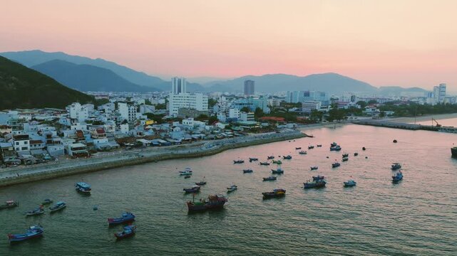 Aerial of traditional Vietnamese fishing boats with red flags at sunset, Nha Trang
traditional wooden fishing boats anchored in the Lang Chut area of Nha Trang, Vietnam