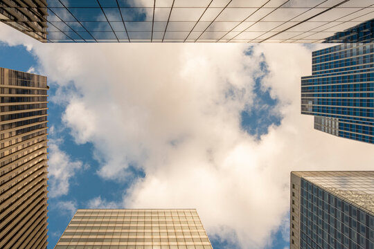 Skyscraper architecture in Paris La Defense framed by clouds background expressing corporate office finance business space and modern city identity