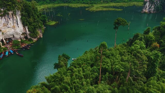 Aerial view popular tourist cave in Khao Sam Kloe in national park Cheow Lan Lake, Thailand.