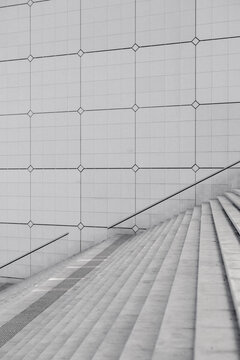 Monochrome abstract architecture stairs in concrete with minimal geometry lines and symmetry creating modern pattern background