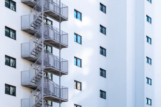 Minimal architecture building exterior with metal staircase and windows creating geometry pattern and open space for design background
