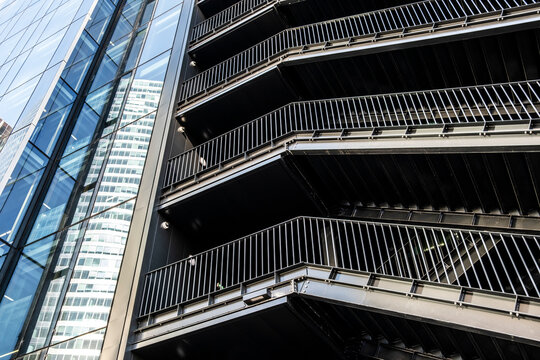 Modern urban architecture building exterior with metal balconies creating geometry pattern and strong perspective for design use