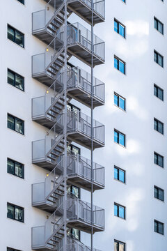 Minimal architecture building exterior with metal staircase and windows showing geometry pattern in clean urban design background