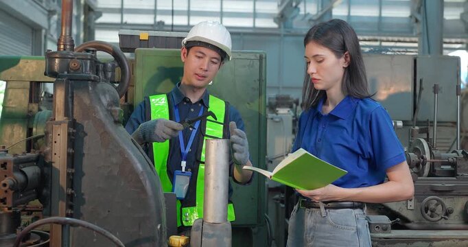 Entrepreneur explains custom DIY workpiece requirements to an engineer, reviewing parts, design options and prototype specifications in a workshop during development planning.
