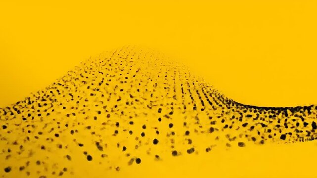 Abstract wave pattern of dark dots against bright yellow background