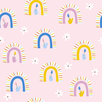 Seamless pattern with rainbows and flowers. Cute childish pastel print. Vector hand drawn illustration.