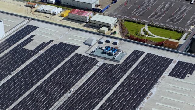 Aerial drone view of solar panels and Ventilation units on massive distribution centre near Coalville UK