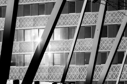 Abstract monochrome architecture facade with structure beams and diagonal geometry creating modern pattern and graphic texture in close detail