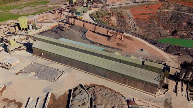Aerial perspective of industrial aggregate processing and excavation at an open cast mine in Coalville.