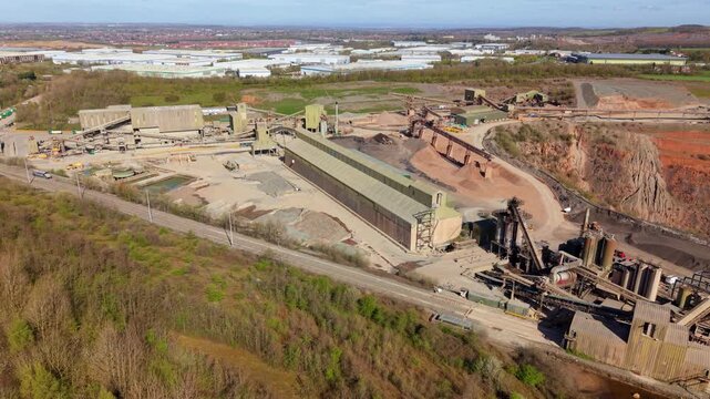 Aerial perspective of industrial aggregate processing and excavation at an open cast mine in Coalville.
