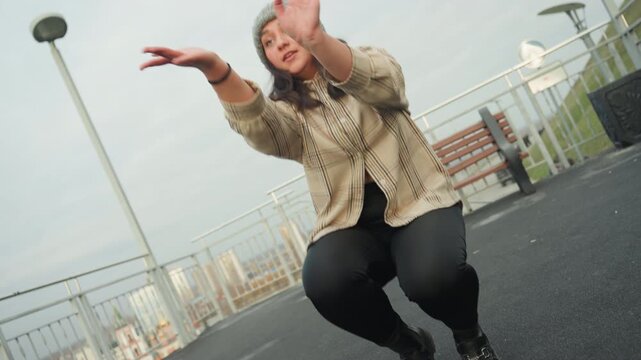 Closeup street dancer executing precise footwork on asphalt, low camera angle captures boot stomp and pivot, gritty pavement texture and skyline hint, rehearsal vibe with busker intensity, trainerlike