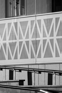 Modern architecture facade abstract geometric pattern with structure bracing glass lines in high contrast monochrome design detail