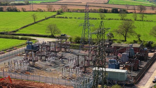 Detailed close up aerial view of electrical substation, with busbars, high voltage pylons and transformers in Coalville UK