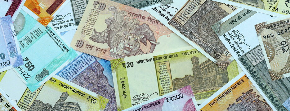 Indian rupee money banknotes pile on table. India bills of INR currency. Concept of economy