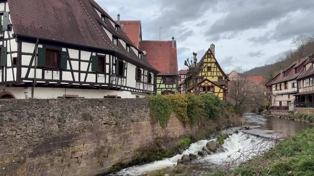 Traditional timberframe houses at Kaysersberg town centre. Motion of Weiss river water. Panoramic, scenic view. Kaysersberg, Alsace, France