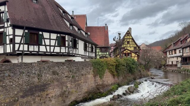Traditional timberframe houses at Kaysersberg town centre. Motion of Weiss river water. Panoramic, scenic view. Kaysersberg, Alsace, France