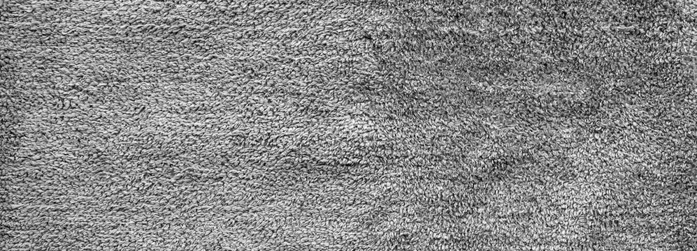 Fluffy gray bathroom carpet texture surface. Fur material of rug for backdrops