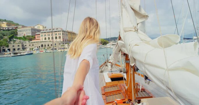 POV, woman and couple on boat with holding hands, travel adventure and excited for summer holiday. Face, people and walk on yacht with healthy relationship, love or tropical vacation together at sea.