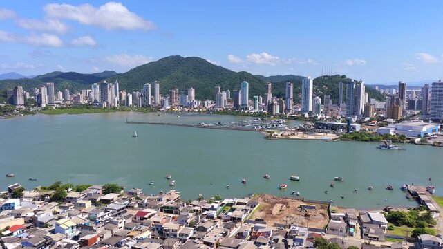 Aerial view of Itaja&iacute; city and Itaja&iacute;-A&ccedil;u river with marina and port entrance in Brazil.