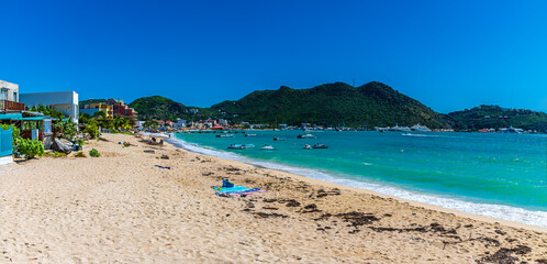 A panorama view across the Great Bay Beach in Philipsburg, Sint Maarten on a sunny day