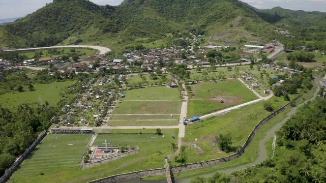 A solemn and historic stock footage shot of the Yolanda Memorial Cemetery in Tacloban City, Leyte. This sacred ground serves as the final resting place for many victims of Super Typhoon Yolanda