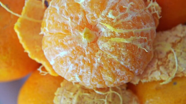 peeled clementines on presentation table