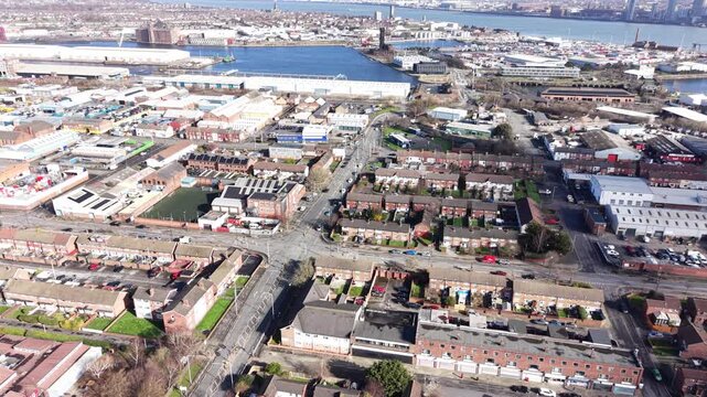 4K drone footage showing Birkenhead town centre with varied rooftops along central streets.
