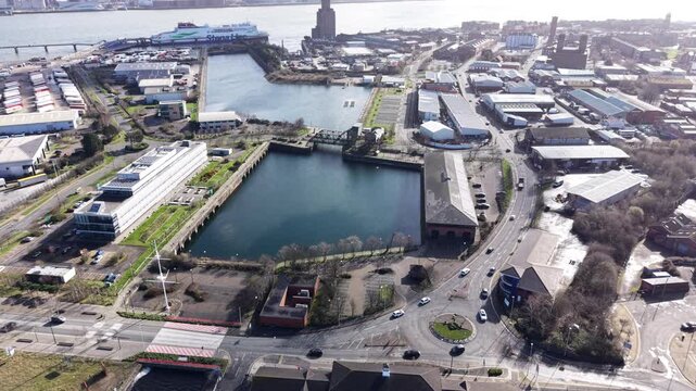 4K drone footage showing Birkenhead Dock Merseyside with a large dock basin and surrounding waterfront structures.