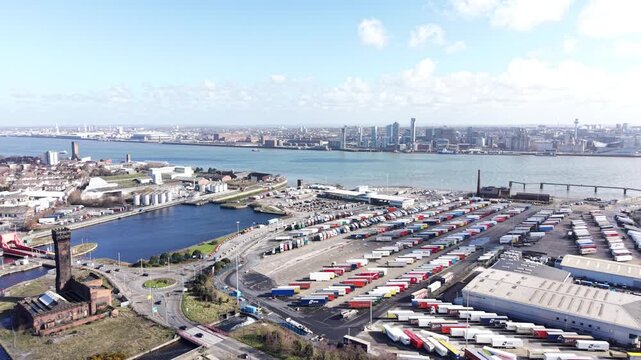 4K aerial video showing Birkenhead Dock Merseyside with industrial quay areas beside open water.