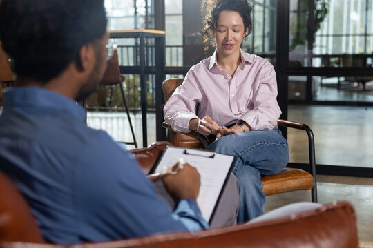 Woman talking during consultation with man