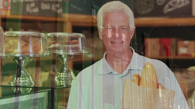 Cam pulling back revealing senior man holding bag with loaves in shop, sales charts rising, smiling