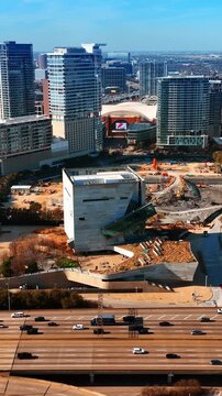 Numerous transport moves by the roads at daytime. Panoramic view of Dallas, Texas, USA from top.