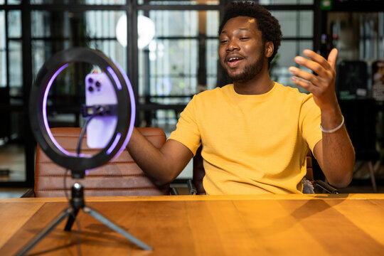 Male influencer explaining topic during live video recording